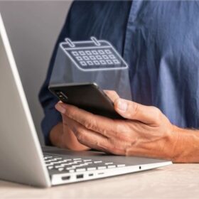 man-using-calendar-phone-while-sitting-table-with-laptop-work-planning-schedule-events-activities-meetings-agenda-preparing-min-2-2-600x450